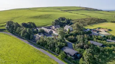 an aerial view of a house in a field at Hill Side Barn in Ireleth