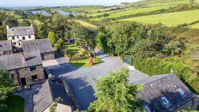 an aerial view of an old house in the countryside at Elm Lodge in Ulverston