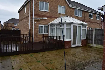 a house with a greenhouse on the front of it at Redwood House in Liverpool