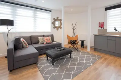 a living room with a couch and a table at Blackbird Luxury Apartments Room 5 in Blackpool