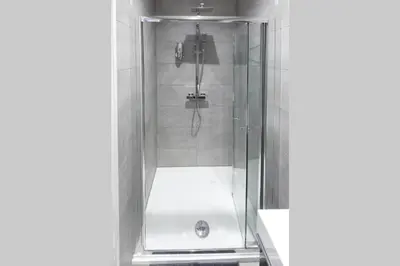 a shower with a glass door in a bathroom at Blackbird Luxury Accommodation Studio Room 9 in Blackpool