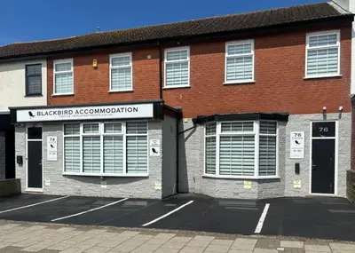 a red brick building with a sign on it at Blackbird Luxury Accommodation Room 10 in Blackpool