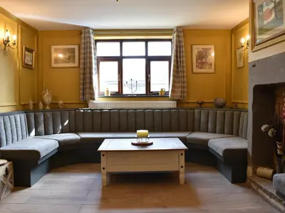 a living room with a couch and a table at Five Dorchester Drive - Uk32043 in Inglewhite
