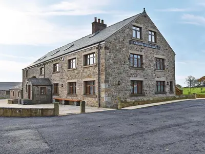 an old stone building with a street in front of it at Three Dorchester Drive - Uk32039 in Inglewhite