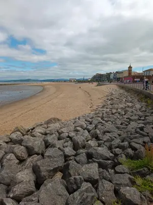 a large group of rocks on a beach at Eden Vale First Floor Sea View Apartment in Morecambe