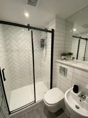 a bathroom with a shower and a toilet and a sink at Kempston Suites Liverpool Apartment 4 in Liverpool