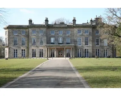 a large stone building with a pathway in front of it at Central Wigan welcoming Townhouse sleeps up to 6 in Wigan