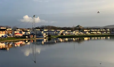 a large body of water with houses and condos at Plot 188D Lakeside Cabin, Wyldecrest, Millom in Millom