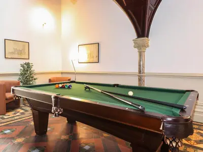 a pool table in a living room with a pool table at The Emma Suite Stone Cross Mansion in Ulverston