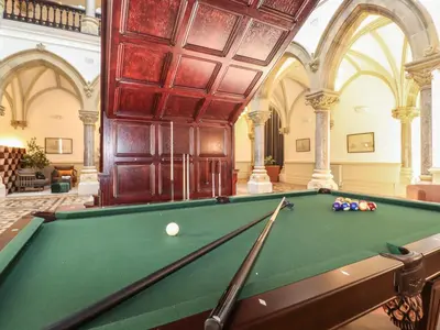 a pool table in a large room with afits at The Violet Suite Stone Cross Mansion in Ulverston