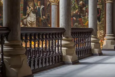a hallway of a cathedral with paintings on the wall at The Kathleen Suite Stone Cross Mansion in Ulverston