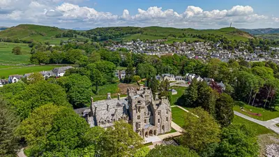 an aerial view of an old castle in a town at The Florence Suite Stone Cross Mansion in Ulverston