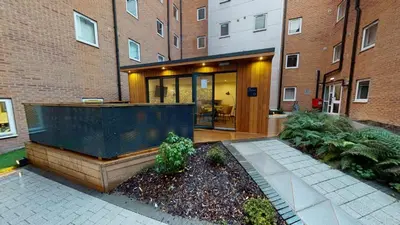 a house with a large glass door in front of a building at iQ Great Newton House in Liverpool in Liverpool