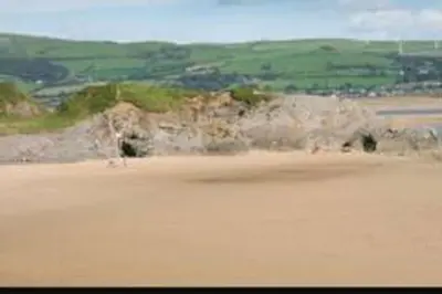 a view of a sand field with a hill in the background at Beauview Brand New For 2023 Wi-Fi and Smart TV in Millom